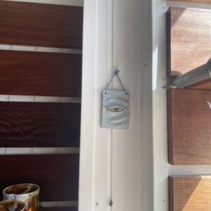 lille vægrelief. `et træt øje` unik.